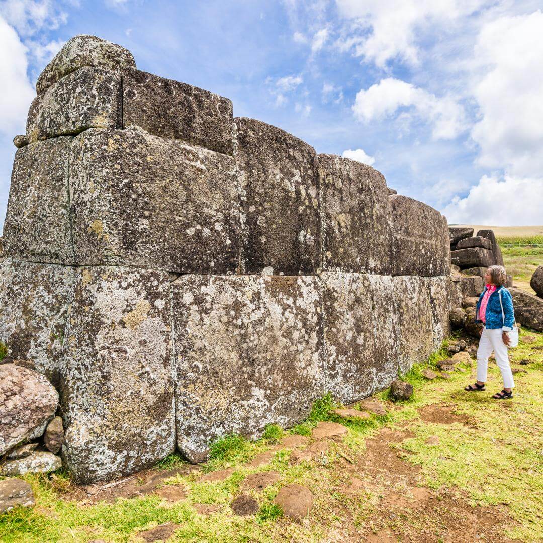 Tourist in front of Ahu Vinapu, Easter Island, Chile