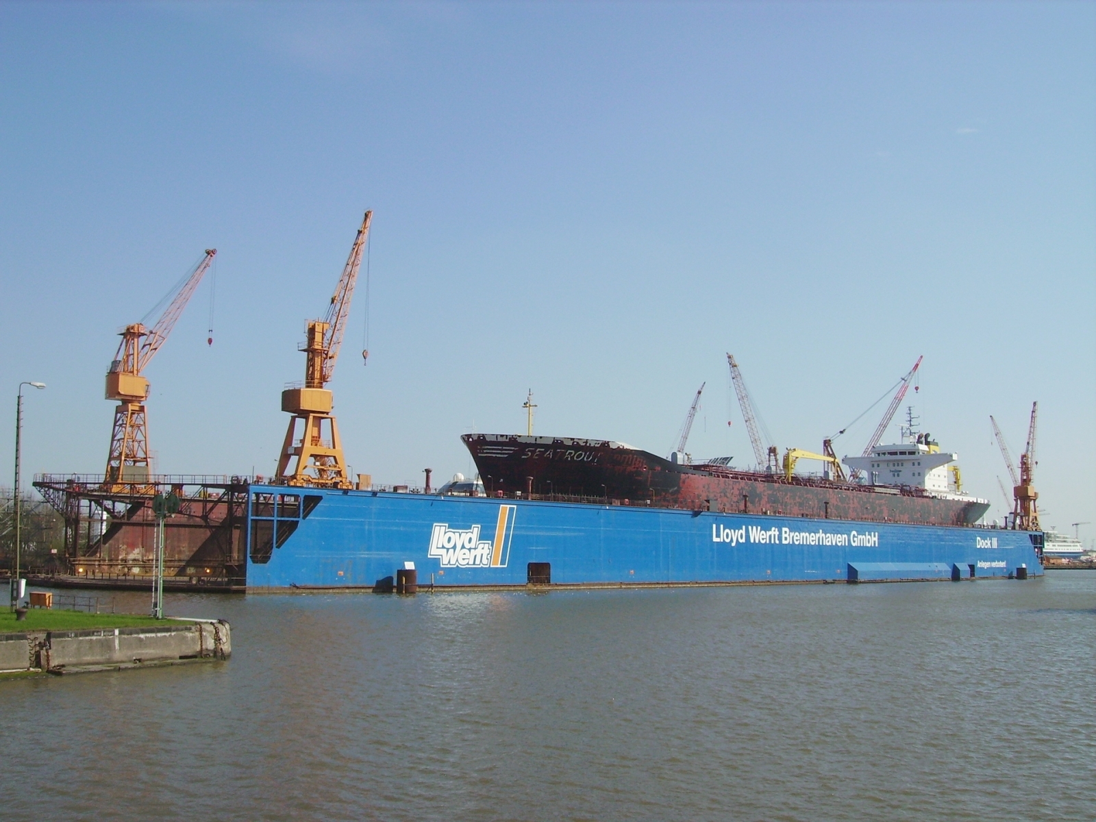 The floating dock of the Lloyd shipyard in Bremerhaven, Germany. Inside the dock we see the tank ship "Seatrout"