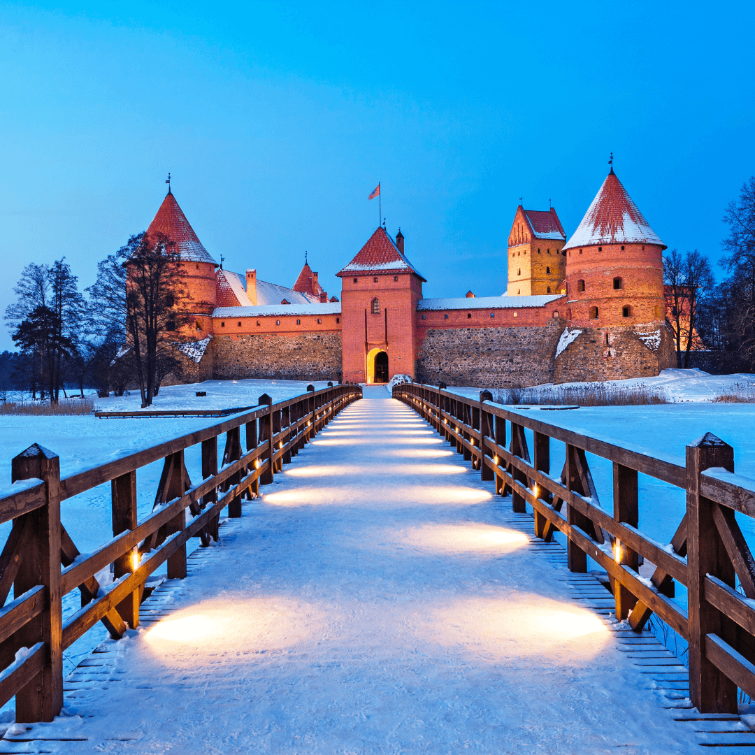 Trakai. Trakai is a historic city and lake resort in Lithuania. It lies 28 km west of Vilnius, the capital of Lithuania