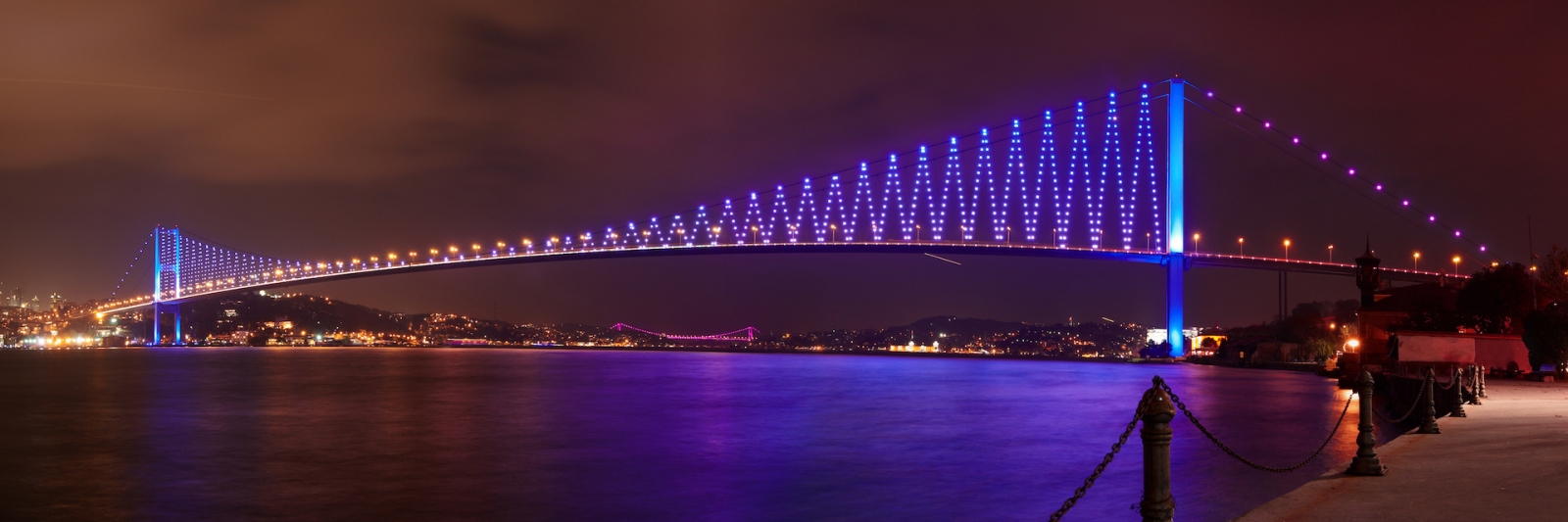 Illumination of the Bosphorus Bridge at night in Istanbul