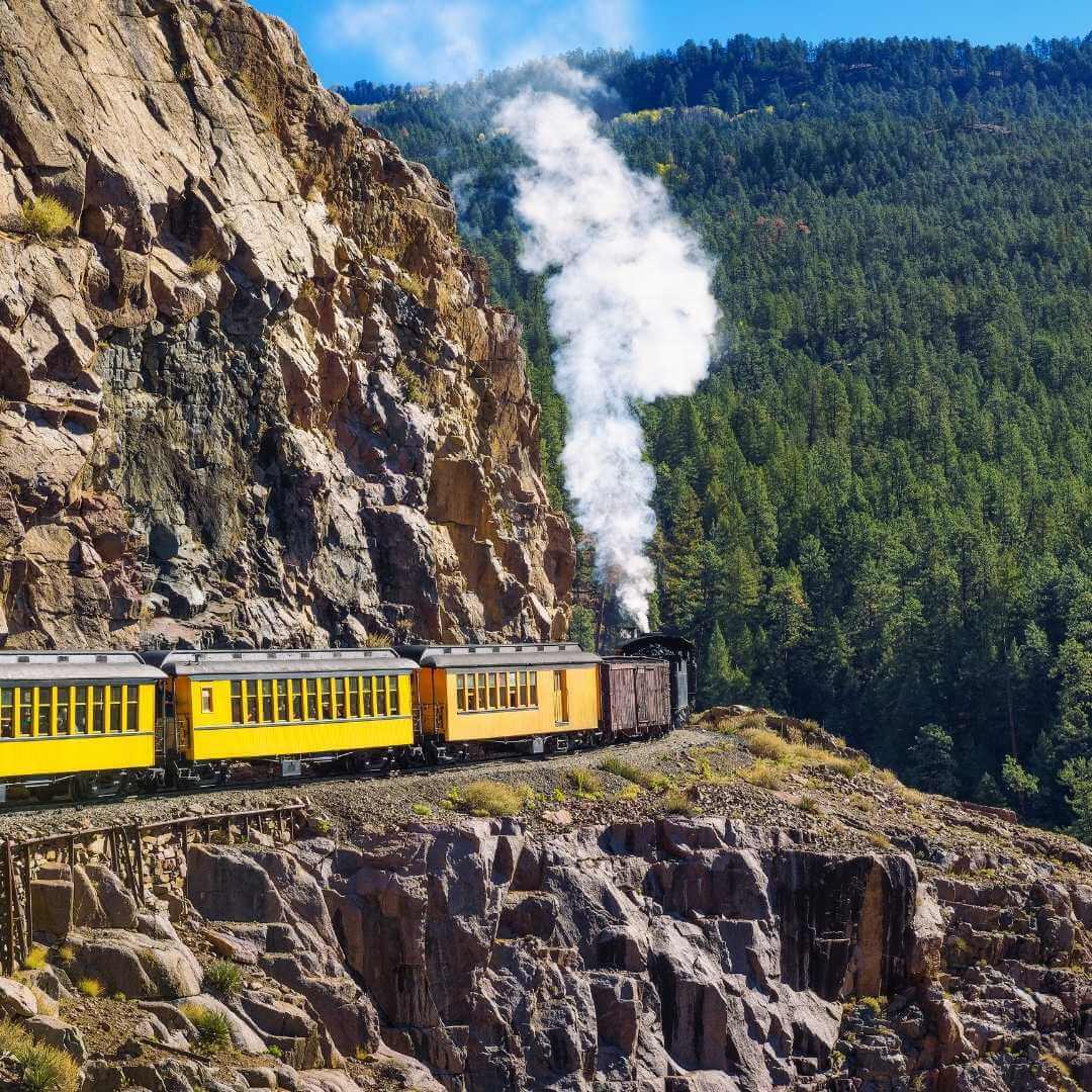 Historic steam engine train travels from Durango to Silverton through the San Juan Mountains in Colorado, USA